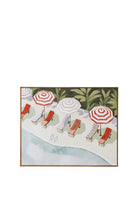 A framed oil painting of a poolside terrace viewed from above, with red, white and cream striped umbrellas, matching sun loungers, a pair of flip-flops on a pale stone deck, a pale blue-green pool and green foliage in the background.