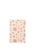 A cream cotton tea towel printed with a coral line-art pattern of wine glasses, wine bottles, martinis, pasta bowls, cheese, artichokes, cherry tomatoes and tinned fish.