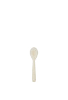 A small ivory resin spoon with subtle natural marbling, a rounded bowl and short straight handle.

